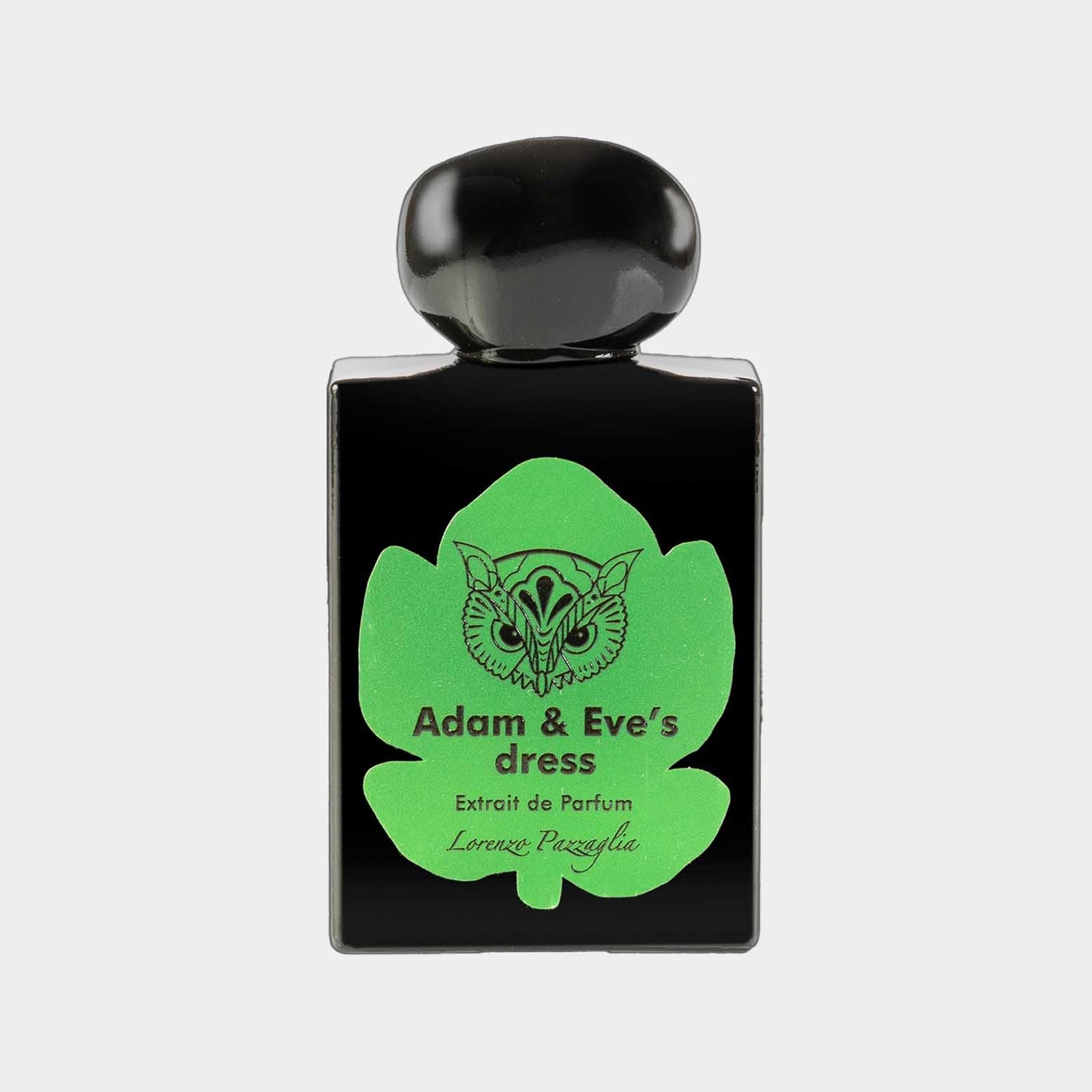 A full bottle of Lorenzo Pazzaglia Adam & Eve's Dress perfume, featuring a sleek black design with a vibrant green leaf motif and label. The bottle is elegantly topped with a round black cap.