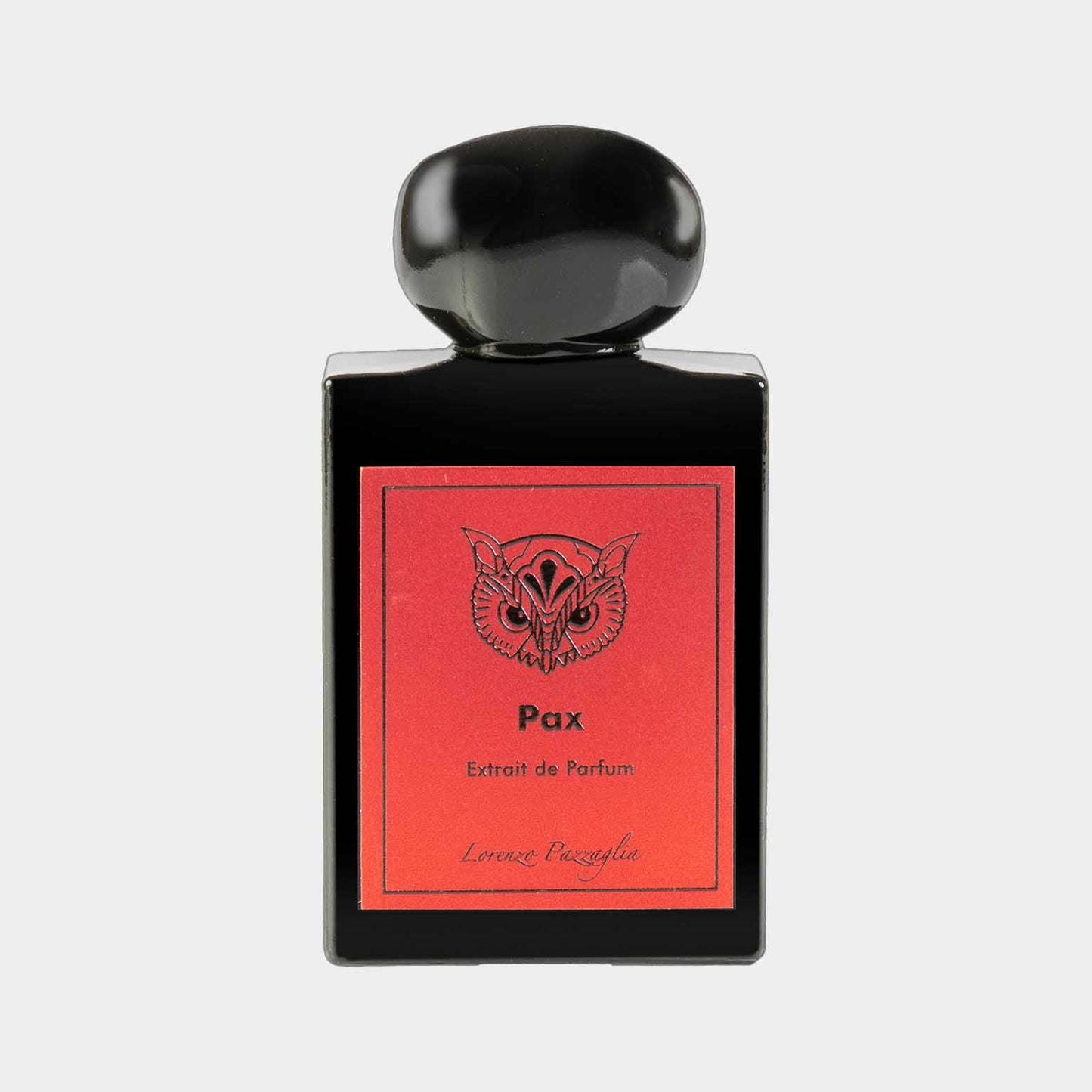 A sleek black bottle of Lorenzo Pazzaglia Pax Extrait de Parfum, featuring a vibrant red label with a decorative owl design. The elegant shape and distinctive cap enhance its luxurious appeal.