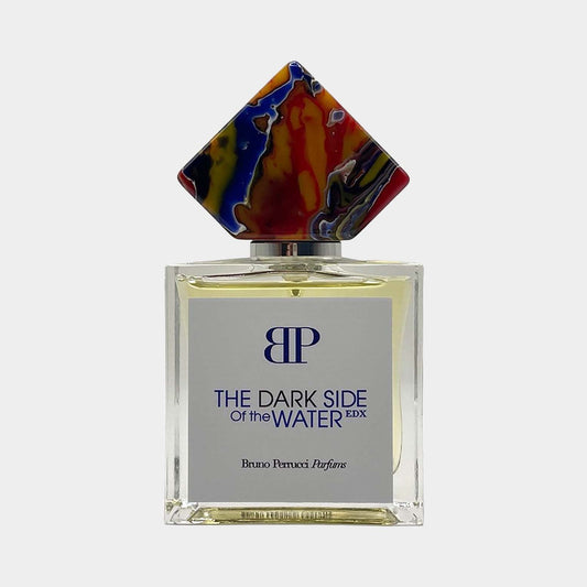 Bruno Perrucci The Dark Side of the Water sample featuring an elegant glass bottle with a colorful, artistic cap and a sleek design.