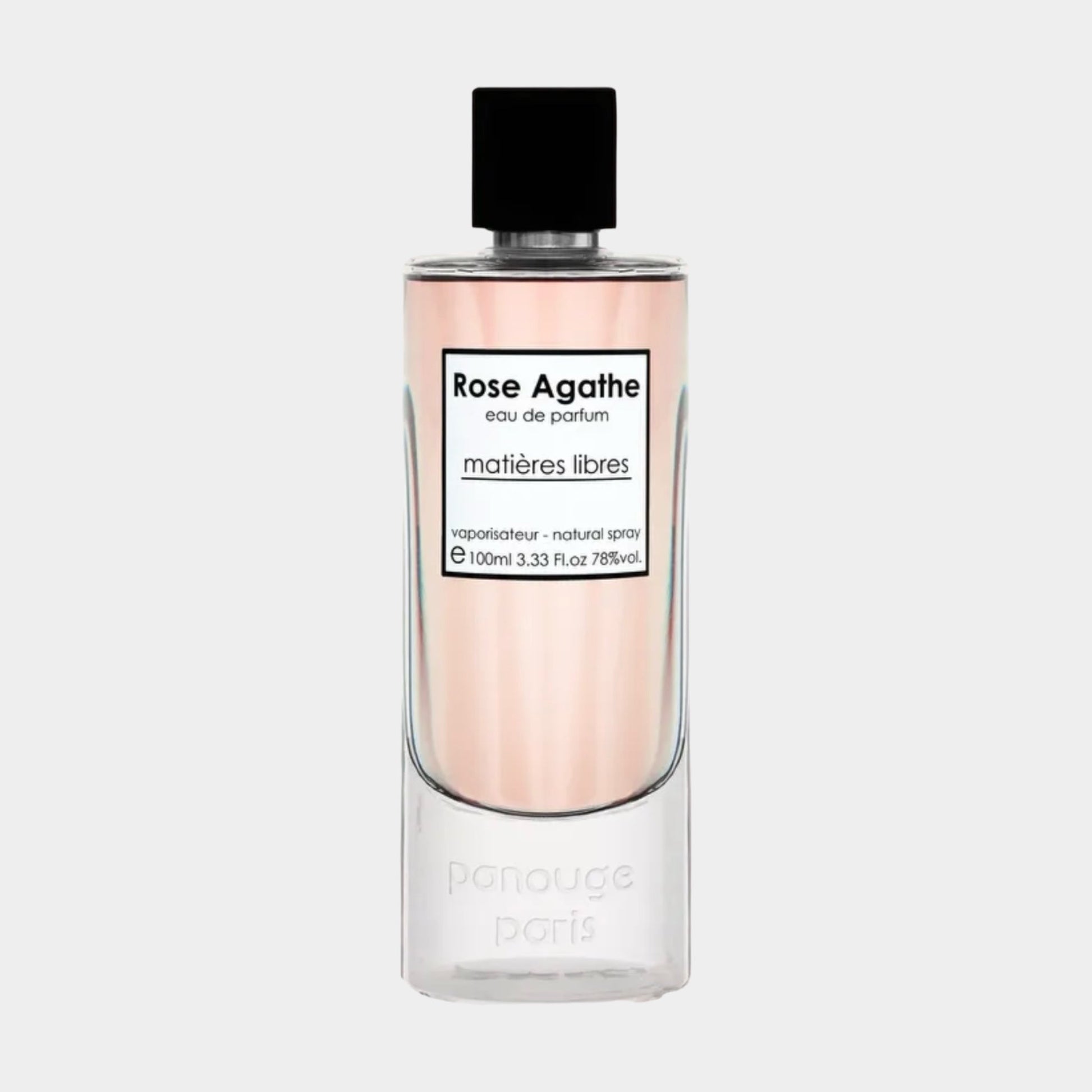 A transparent perfume bottle with a sleek design, featuring a black cap and a label that reads Panouge Paris Rose Agathe in elegant font. The liquid inside is a soft pink hue, showcasing the fragrance's floral essence.