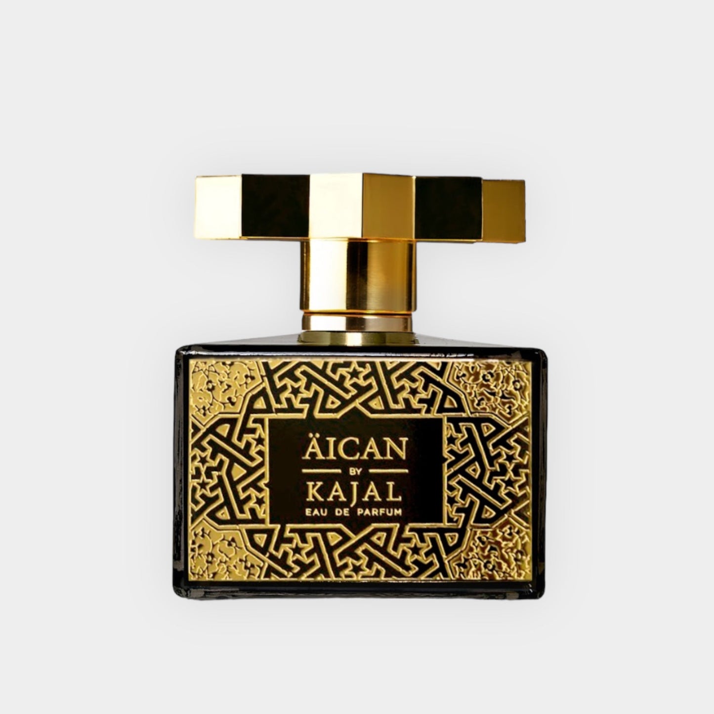 A luxurious bottle of Kajal Aican Eau de Parfum, featuring intricate gold and black design elements, symbolizing elegance and sophistication. This is a sample size, perfect for testing the fragrance.
