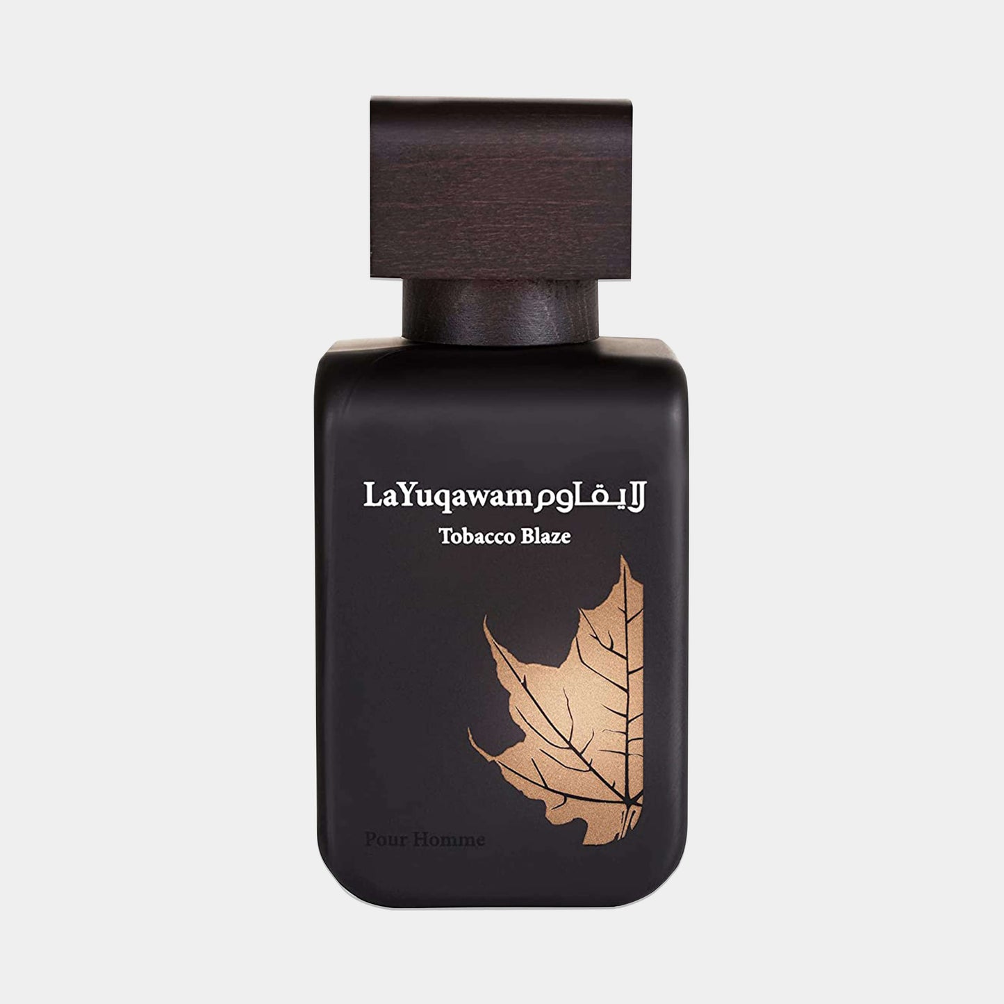A sleek black bottle of Rasasi La Yuqawam Tobacco Blaze Sample, featuring a stylish wood cap and an elegant leaf design on the front. The fragrance is tailored for men.