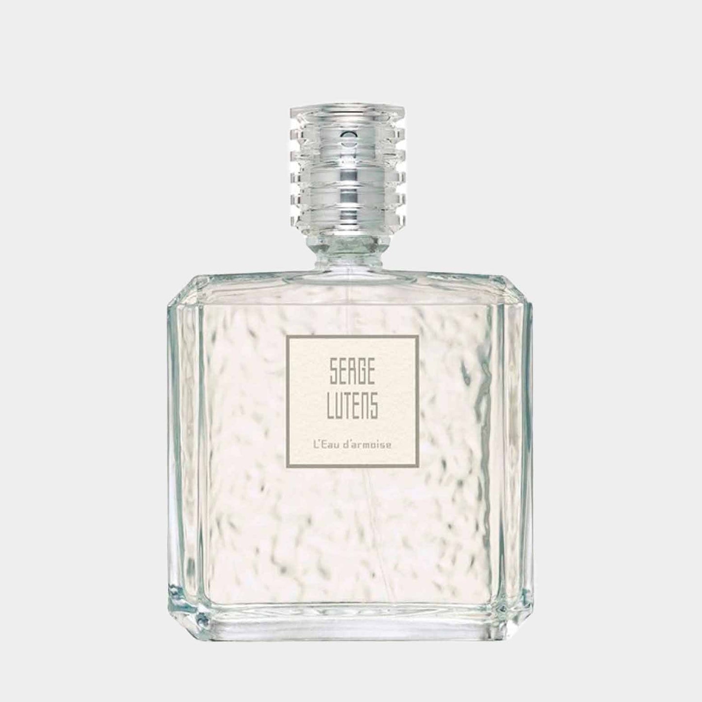 A clear glass sample bottle of Serge Lutens L'Eau d'Armoise, featuring a sleek, modern design with a textured cap and minimalist label.