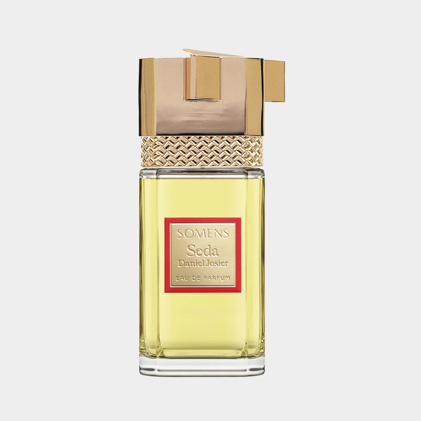 A bottle of Somens Seda Sample, featuring a stylish gold and glass design with a red label, encapsulating an elegant fragrance in Eau de Parfum form.