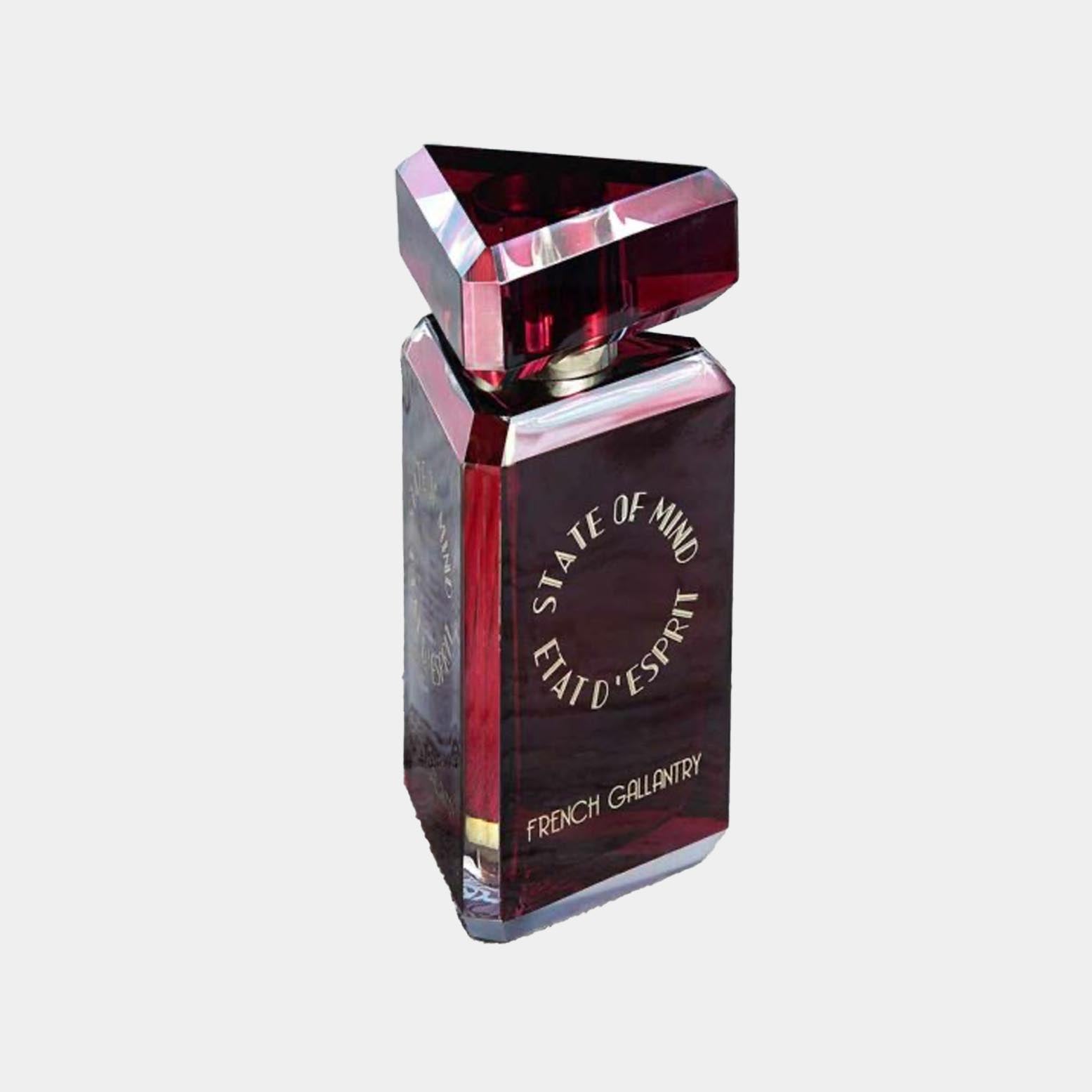 A striking bottle of 'State of Mind French Gallantry Sample', featuring a triangular top and deep red glass design, showcasing its elegant and luxurious appearance.