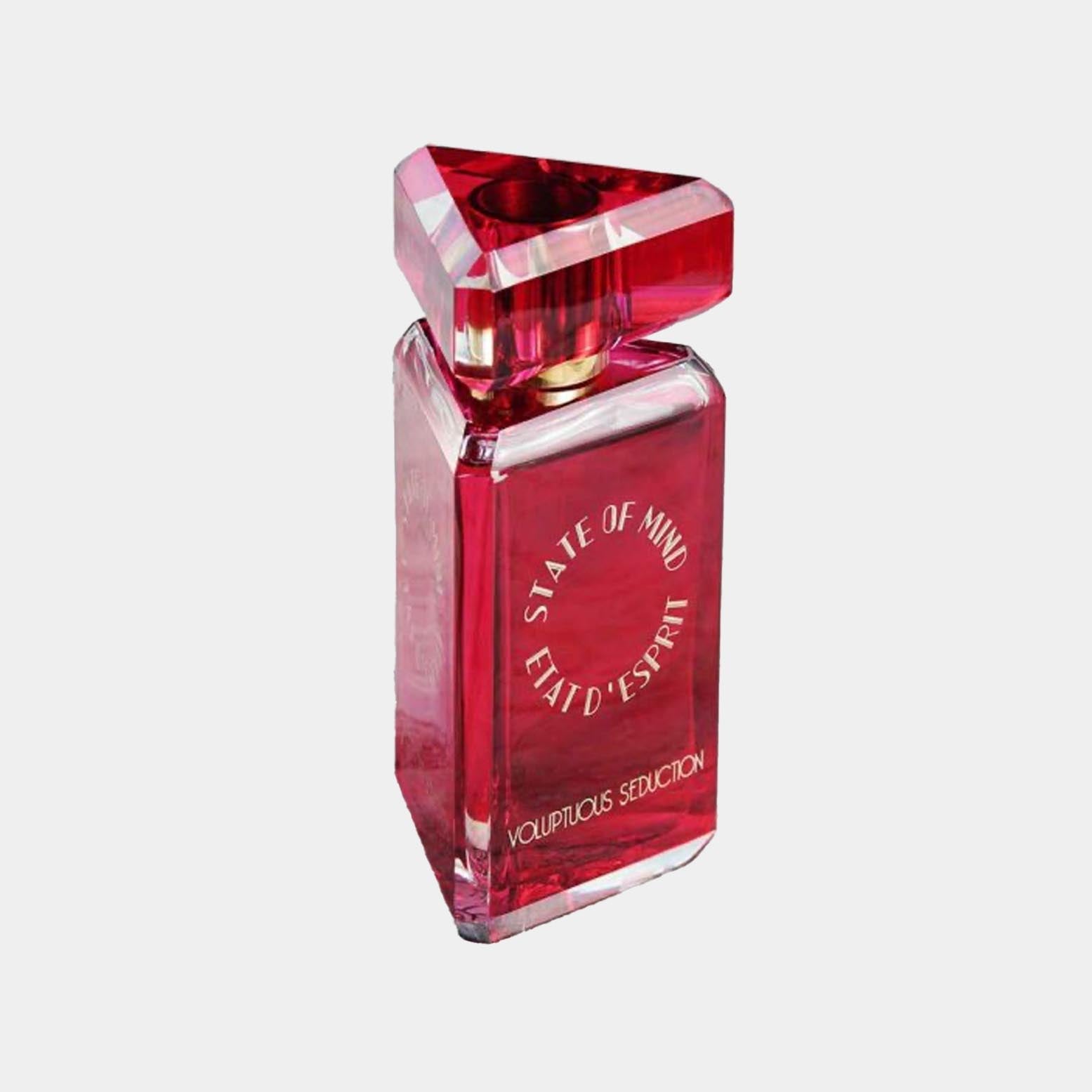 Bottle of State of Mind Voluptuous Seduction Sample, featuring a distinctive triangular cap and a bold, red glass design. The elegant packaging hints at a luxurious fragrance experience.