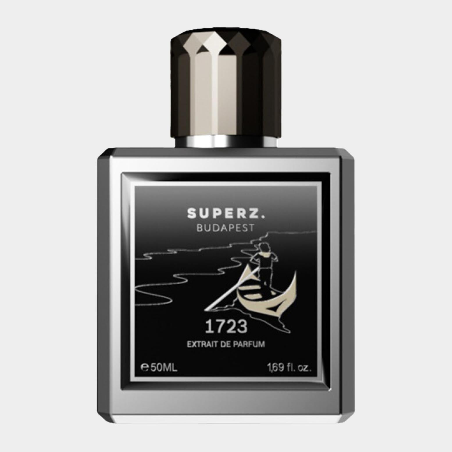 A sleek, square bottle of Superz 1723 Extrait de Parfum, featuring a black label with elegant gold accents and a silver cap, containing 50 mL of fragrance.