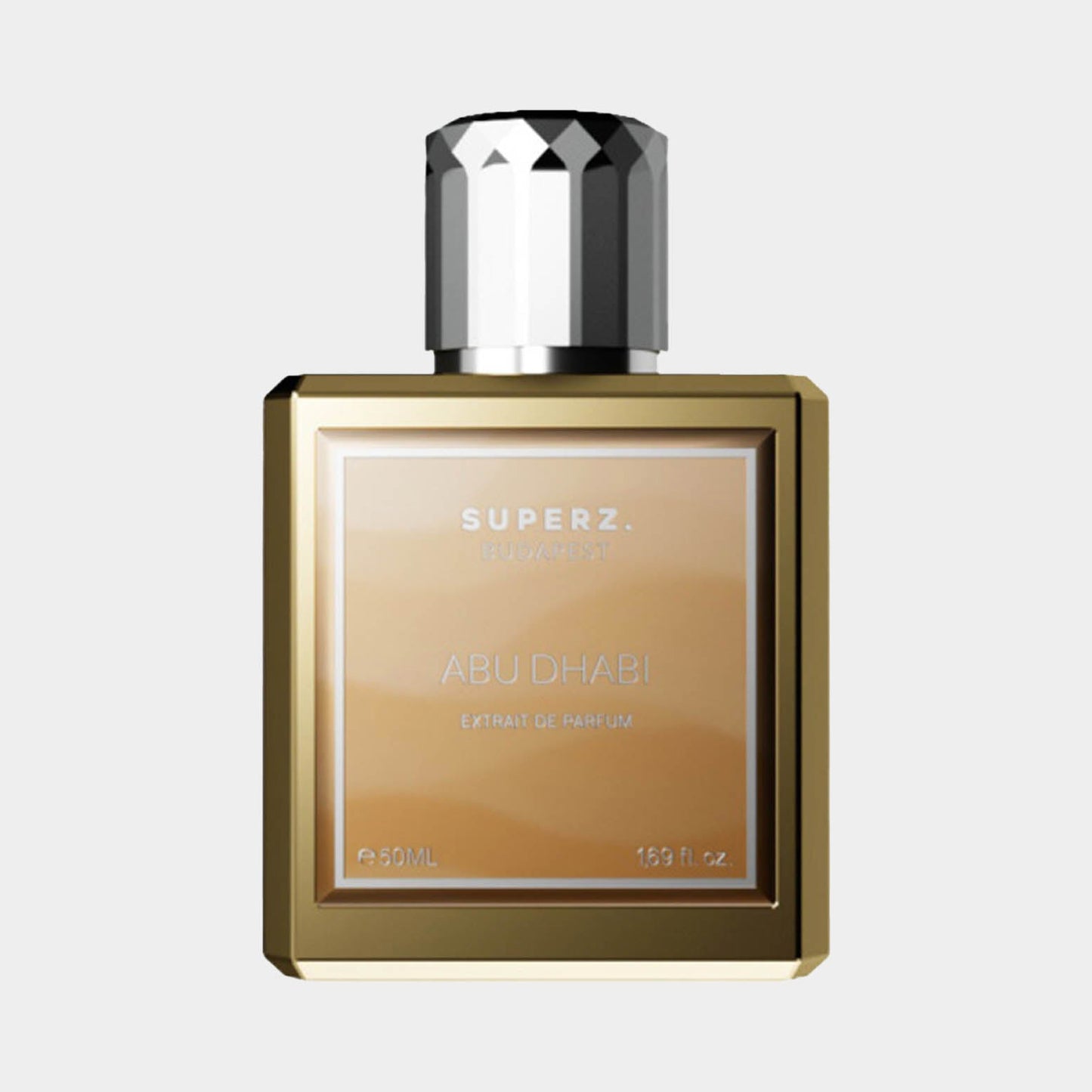 A full bottle of Superz Abu Dhabi, a luxurious extrait de parfum, featuring a sleek gold and glass design with a faceted silver cap. The label displays SUPERZ and ABU DHABI, highlighting its 50ML size.