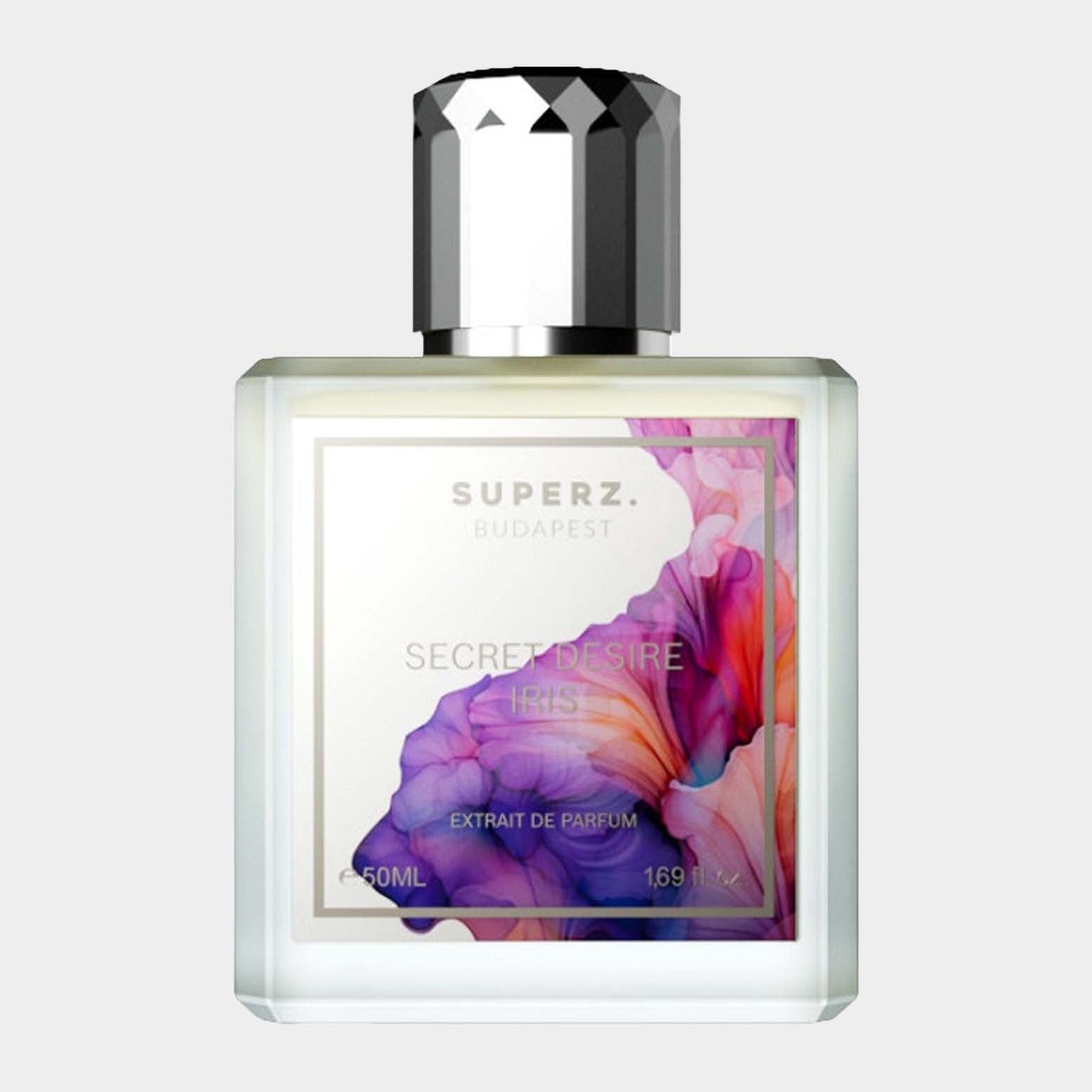 A clear glass bottle of 'Superz Secret Desire Iris Sample' fragrance, featuring an elegant floral design on the label and a stylish silver cap. The bottle holds 50ml of extrait de parfum.