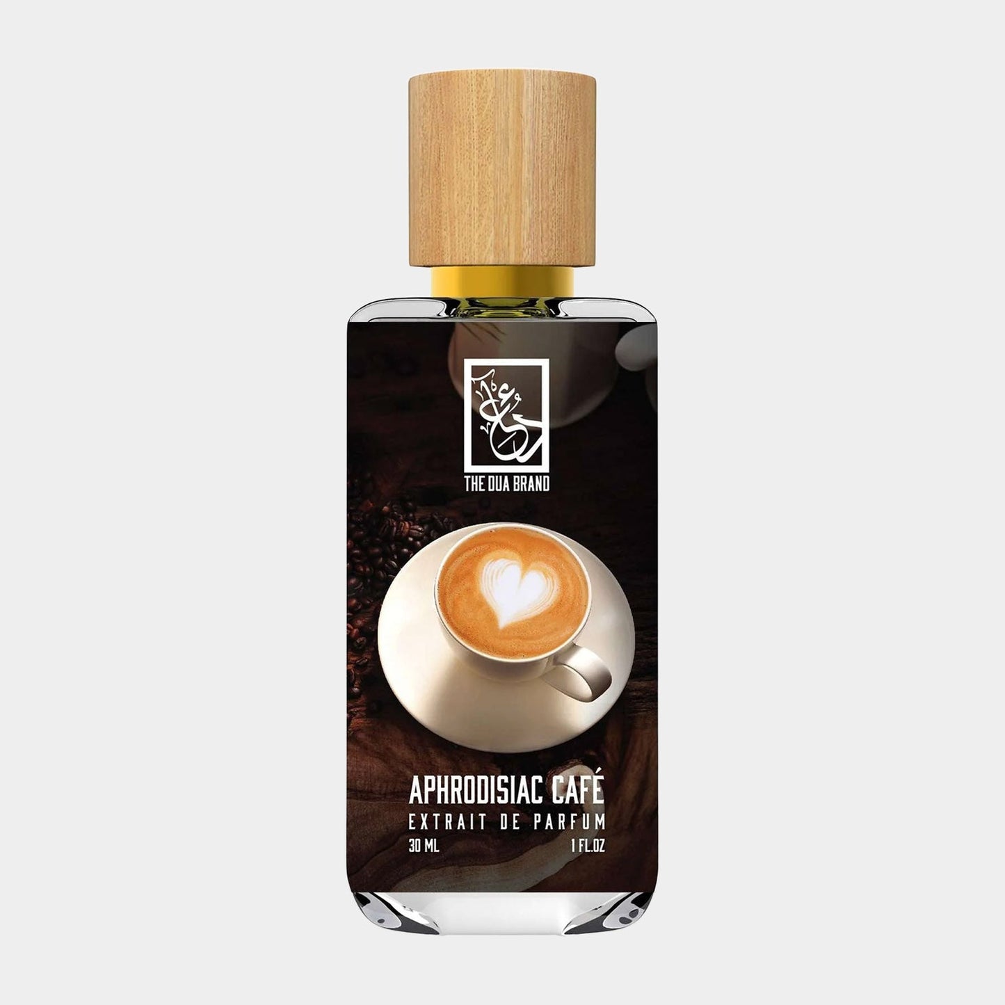 A bottle of Dua Aphrodisiac Cafe perfume, featuring a stylish design with a wooden cap and a background image of a coffee cup with a heart-shaped foam design. The bottle contains 30 ml of fragrant essence.