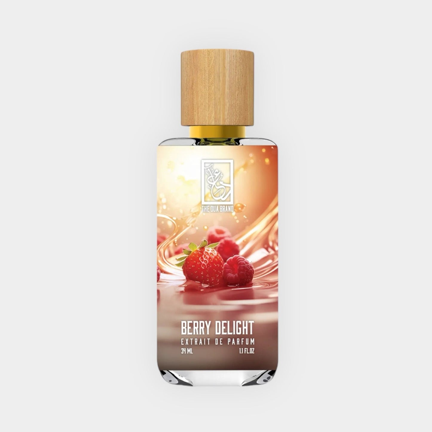 A glass perfume bottle featuring a wooden cap, labeled Dua Berry Delight Sample, showcases a vibrant design with strawberries and raspberries, evoking a fruity and sweet fragrance. The bottle holds 37.5 mL of perfume extrait.