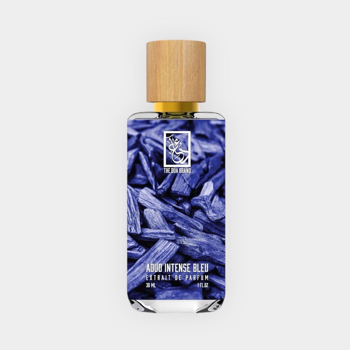 Dua Aoud Intense Bleu Sample is a 30 mL extrait de parfum featuring a striking blue design with a wooden cap, evoking a rich and intense fragrance experience.