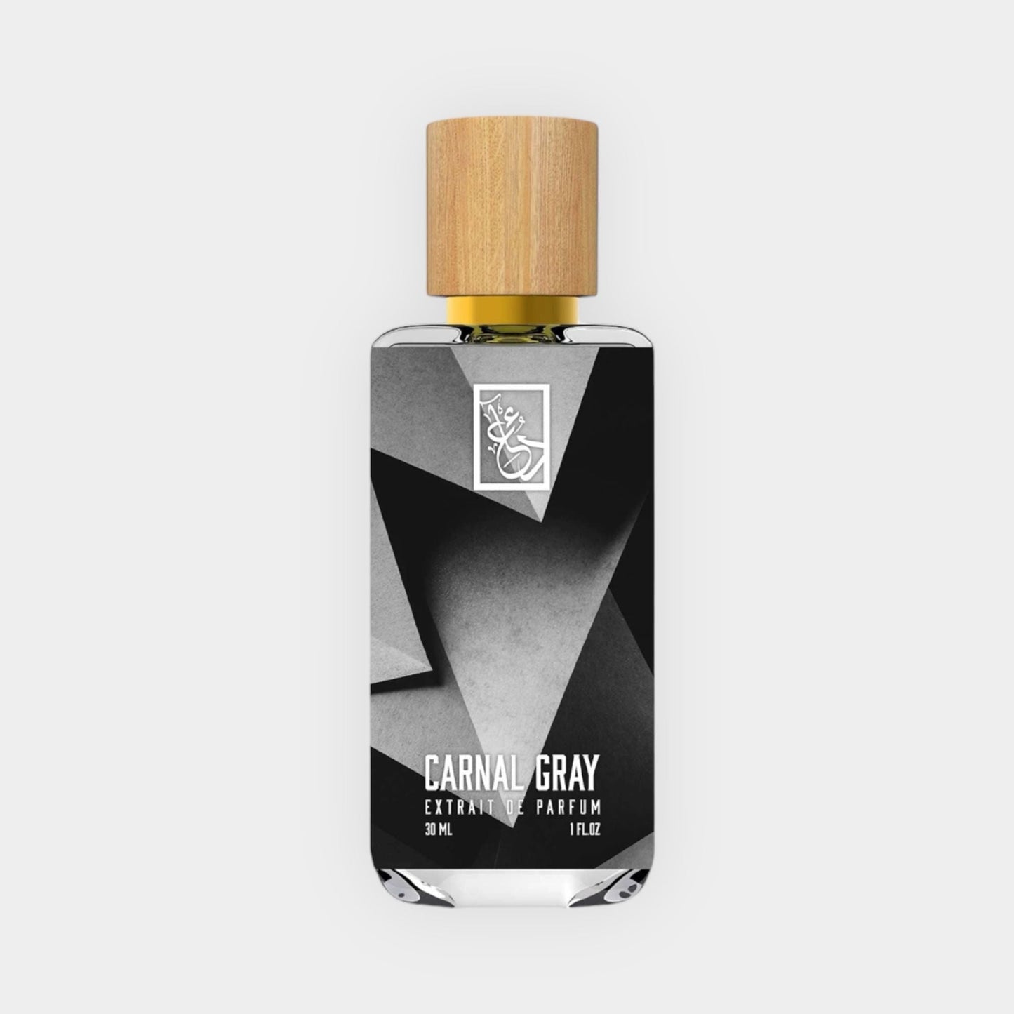 A sleek perfume bottle labeled Dua Carnal Gray Sample, featuring a minimalist design with geometric black and gray patterns and a wooden cap, set against a light background.