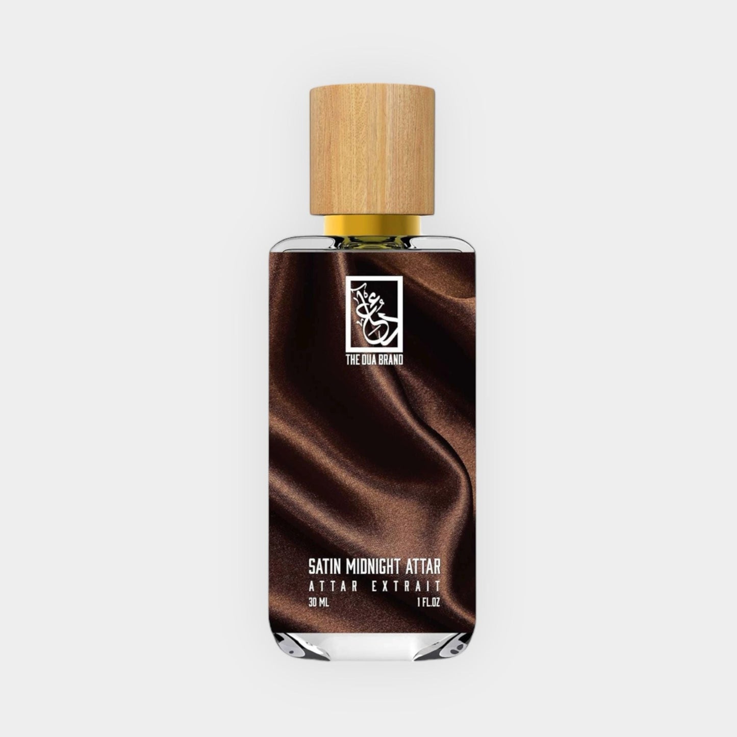 Dua Satin Midnight Attar Sample, featuring a sleek glass bottle with a wooden cap, showcasing its rich, dark liquid against a satin-like background.