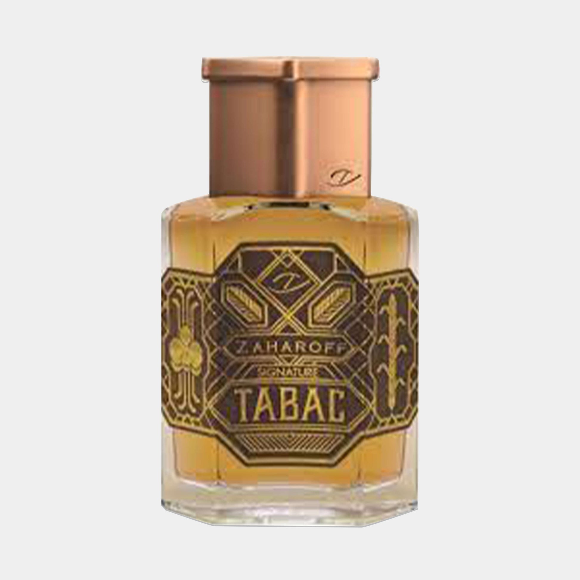 A small bottle of Zaharoff Signature Tabac Sample, featuring an ornate, gold and black label with intricate designs and a copper-colored cap, containing a rich, amber liquid.