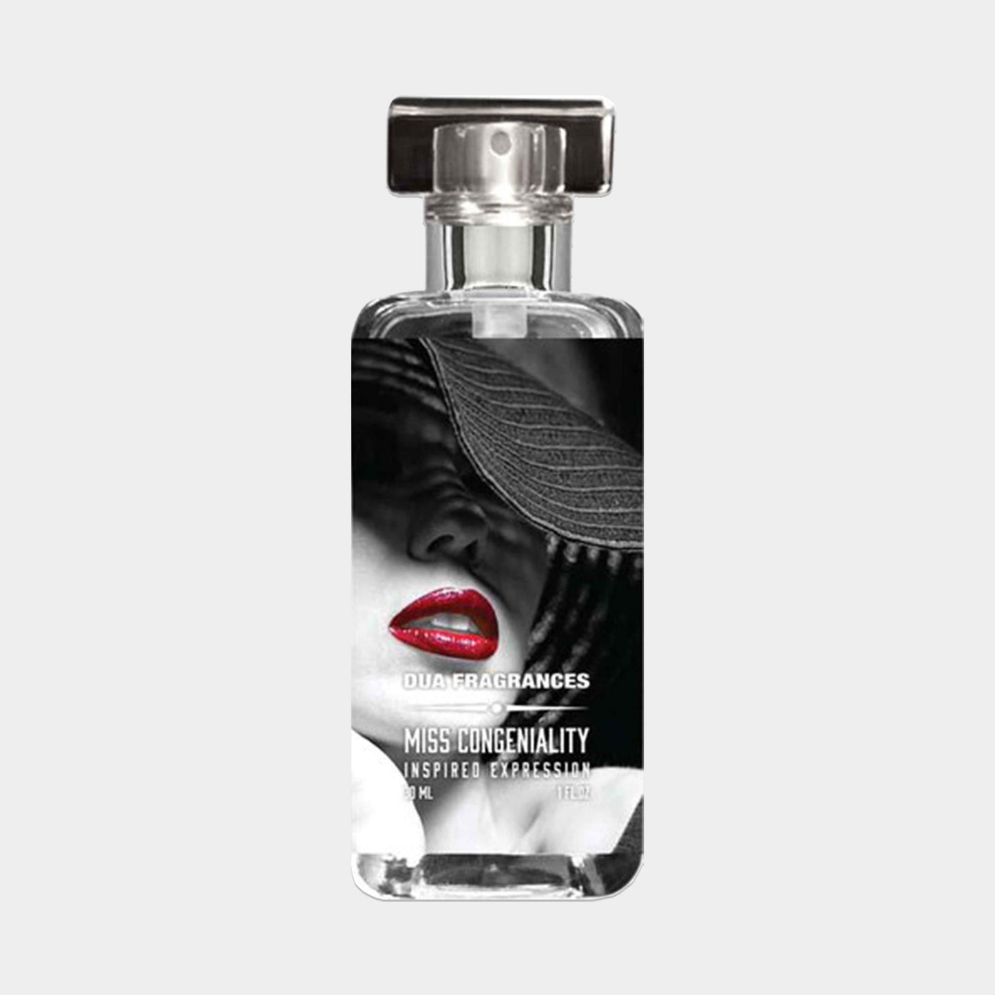 A sleek glass perfume bottle featuring the label Dua Miss Congeniality Sample, showcasing a bold red lip and a woman wearing a wide-brimmed hat. The design suggests elegance and a touch of glamour.