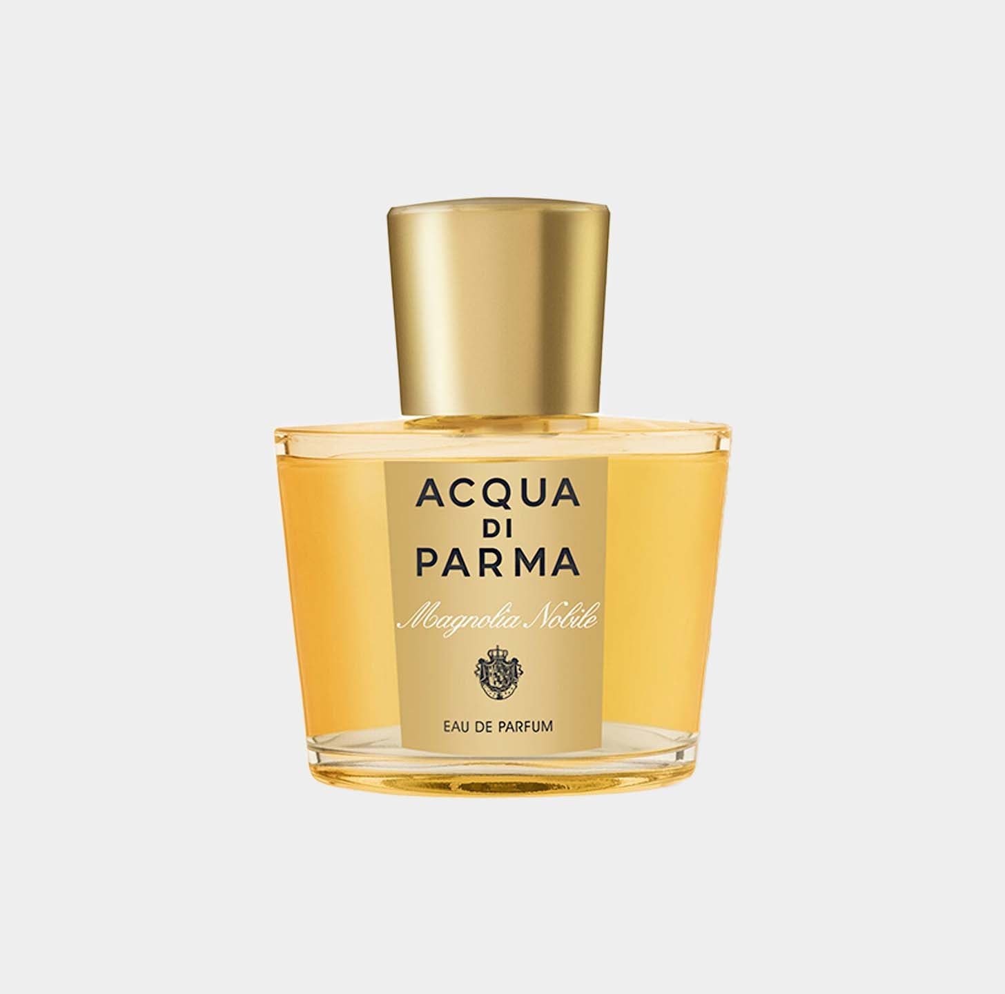 Acqua Di Parma Magnolia Nobile Sample in a clear glass bottle with a gold cap, featuring a label that highlights the brand and fragrance name.