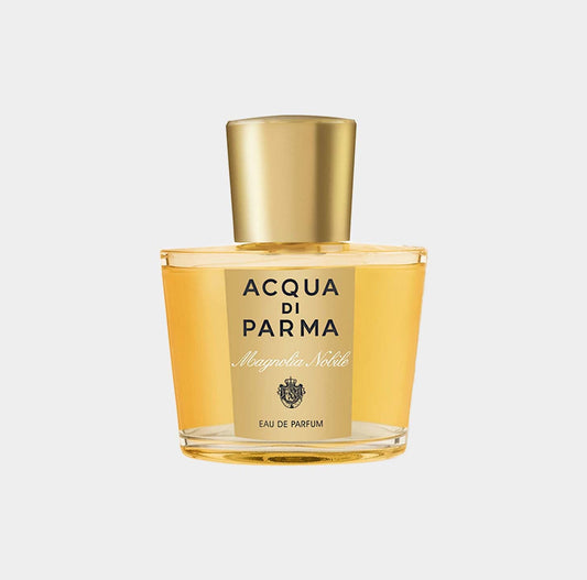 Acqua Di Parma Magnolia Nobile Sample in a clear glass bottle with a gold cap, featuring a label that highlights the brand and fragrance name.