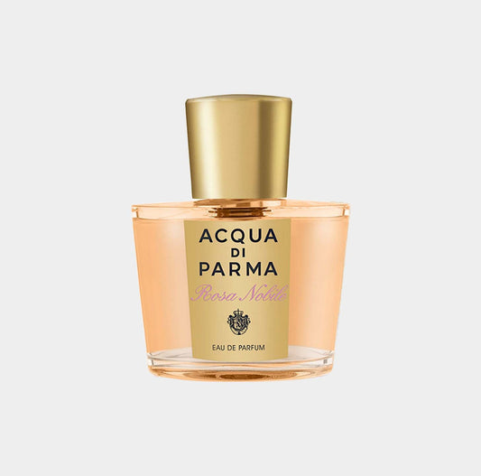 A bottle of Acqua Di Parma Rosa Nobile Sample, showcasing its elegant design with a golden cap and a light pink fragrance inside.