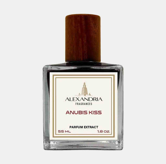 A clear glass bottle of Alexandria Fragrances Anubis Kiss Sample, featuring a wooden cap and a label indicating a 55 ml parfum extract. The elegant design showcases the luxurious scent inside.