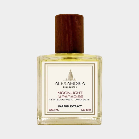 A bottle of Alexandria Fragrances Moonlight in Paradise Sample, featuring a wooden cap and a clear glass design. The label describes the scent profile, highlighting notes of fruits, vetiver, and tonka bean.