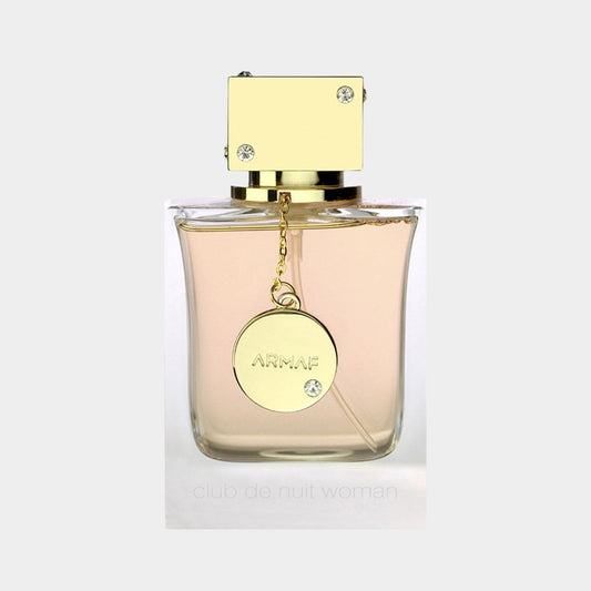 Armaf Club de Nuit Woman EDP Sample featuring an elegant bottle with a square gold cap and a decorative charm, showcasing a soft pink fragrance.