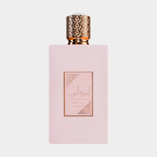 A sleek, pink perfume bottle with an ornate gold cap, featuring the label Asdaaf Ameerat Al Arab Prive Rose Sample elegantly displayed on the front.