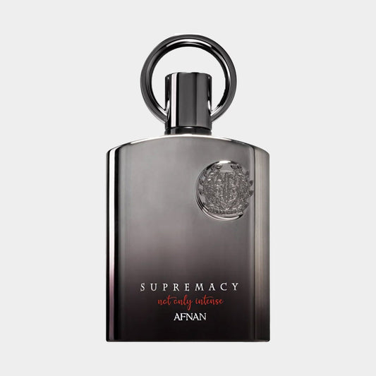 Afnan Perfumes Supremacy Not Only Intense is showcased in a sleek, elegant full bottle, featuring a distinctive round metal cap and a modern design with a gradient black-to-gray finish. The label highlights the perfume's name in stylish lettering.
