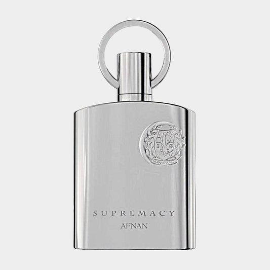 Afnan Perfumes Silver Supremacy Sample features a sleek, metallic bottle with an engraved emblem and a distinctive circular cap, exuding elegance and sophistication. The minimalist design highlights the luxurious essence of the fragrance.