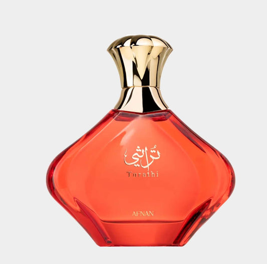Afnan Perfumes Turathi Red Sample features a sleek, curvaceous bottle with a golden cap and vibrant red liquid, elegantly showcasing its luxurious fragrance.
