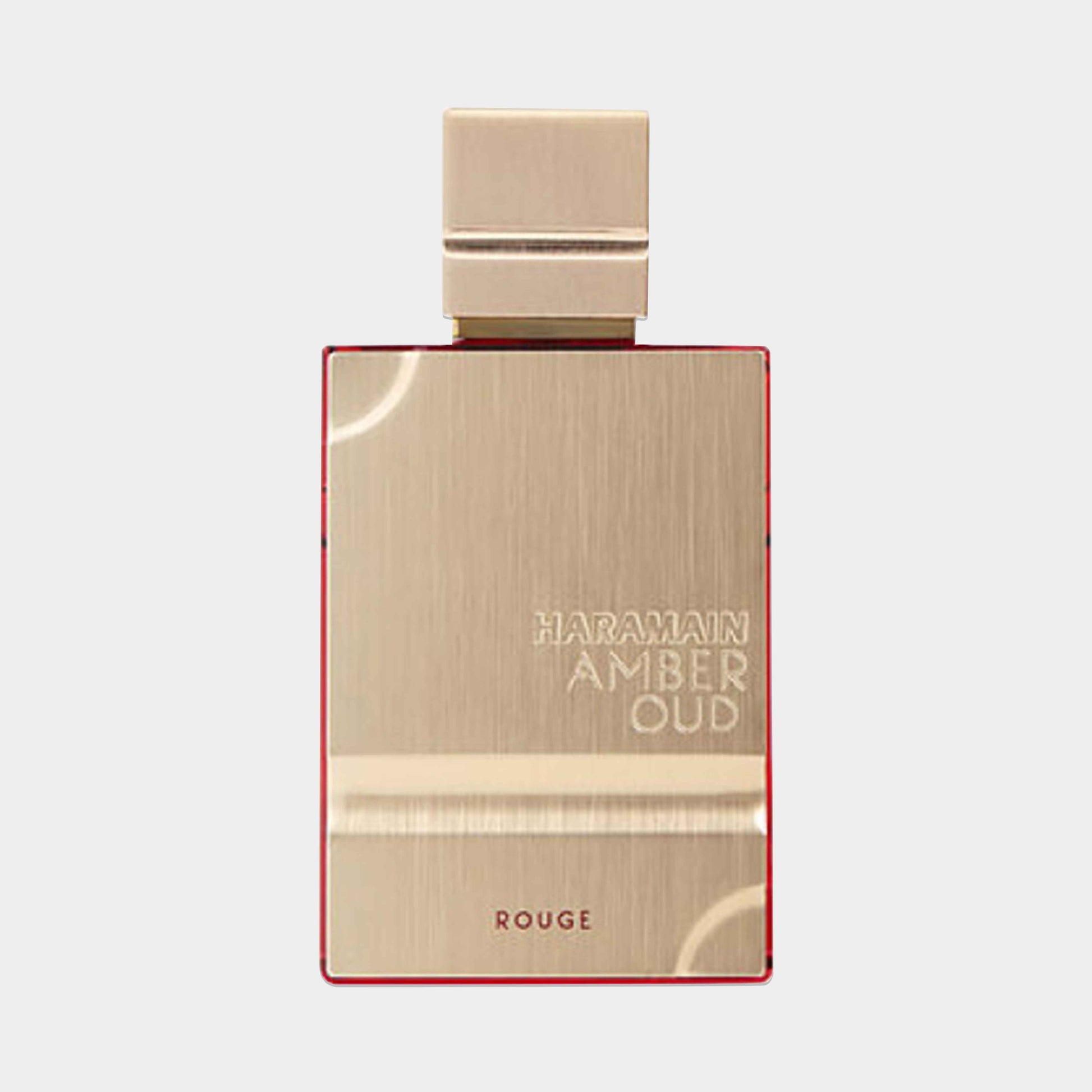 Al Haramain Amber Oud Rouge Sample is a luxurious fragrance featuring a sleek gold bottle with a striking red accent, showcasing its elegant design. The sample is perfect for experiencing the rich, aromatic scent profile of this signature perfume.