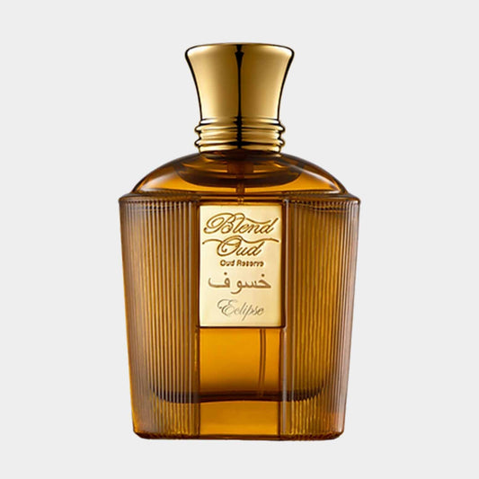 A luxurious perfume bottle from the Blend Oud Reserve Collection, labeled Eclipse, featuring a textured amber glass design and a gold-tone cap.