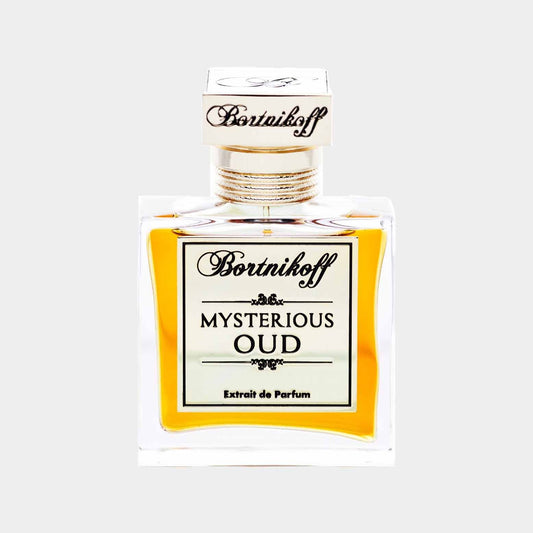 A full bottle of Bortnikoff Mysterious Oud, featuring an elegant design with a gold and black label, showcasing a rich amber liquid inside.