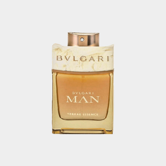 A sample bottle of Bvlgari Man Terrae Essence, featuring a sleek design with a gold cap and a warm amber fragrance fluid inside.