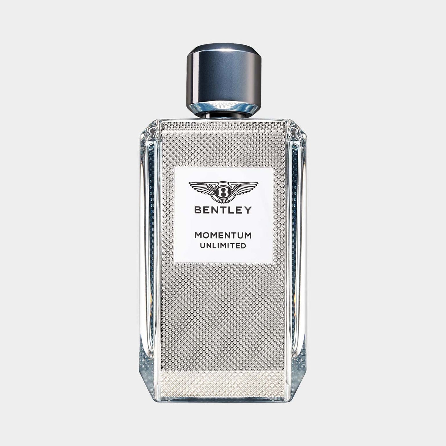 A sleek, silver glass bottle of Bentley Momentum Unlimited sample perfume, featuring a textured design and a silver cap, presented against a light background.