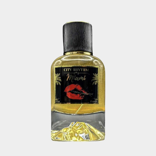A sleek, transparent perfume bottle labeled City Rhythm Miami Tropical Confessions Sample, featuring a gold and black design with a tropical theme. The bottle showcases a vibrant image of red lips and palm trees, capturing the essence of Miami.