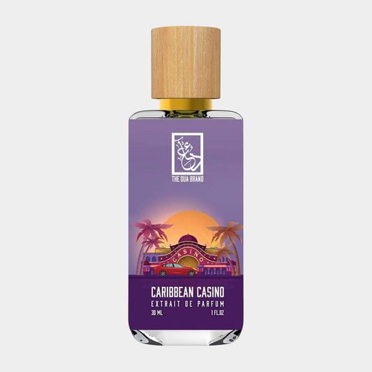 Dua Caribbean Casino Sample, a 30ml extrait de parfum featuring a vibrant bottle with a wooden cap, showcasing a colorful sunset and palm trees in its design.