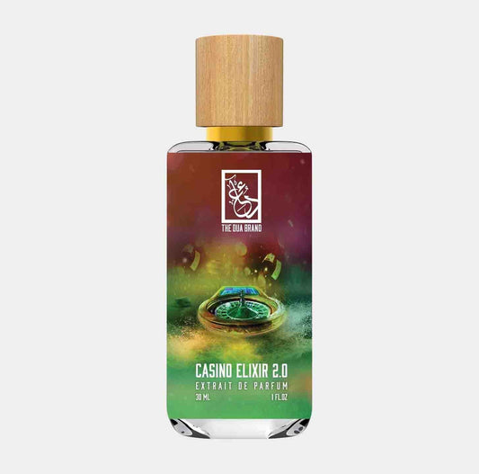 A clear, elegantly designed bottle of Dua Casino Elixir 2.0 Sample with a wooden cap, showcasing a vibrant label featuring casino-themed graphics and the scent's name prominently displayed.