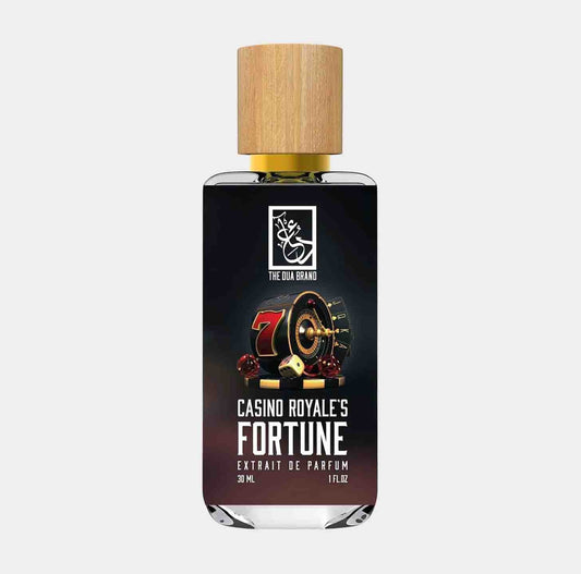 A sleek bottle of Dua Casino Royale's Fortune, featuring a wooden cap and a label that highlights the fragrance's luxurious essence, displayed with a casino theme. The bottle contains 30 ml of extrait de parfum.