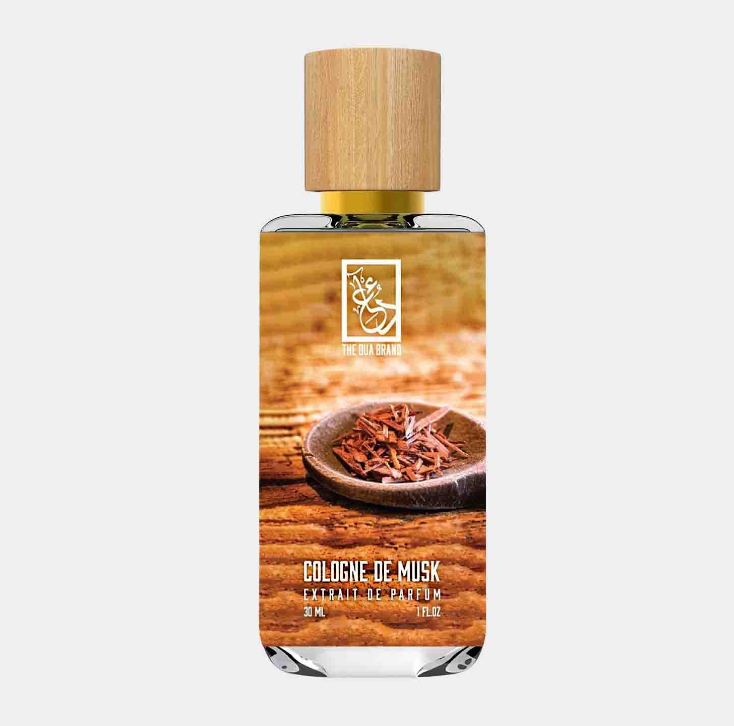 A bottle of Dua Cologne de Musk featuring a sleek design with a wooden cap, set against a textured background. The label highlights the fragrance's name, emphasizing its exotic and musky essence.
