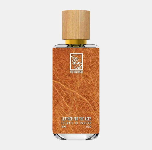 Dua Leather for the Ages Sample, featuring an elegant glass bottle with a natural wood cap, showcasing a rich leather-textured label that highlights its luxurious fragrance.