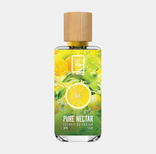 Glass bottle of Dua Pure Nectar Sample, featuring vibrant citrus fruit illustrations on the label, showcasing a refreshing and uplifting fragrance. The bottle has a natural wood cap and holds 30 ml of perfume extract.