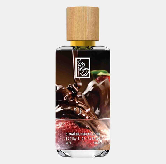 Dua Strawberry Chocolate Oud Sample, featuring an elegant bottle with a wooden cap, showcasing a rich blend of strawberry and chocolate notes. The label indicates a luxurious fragrance extract.