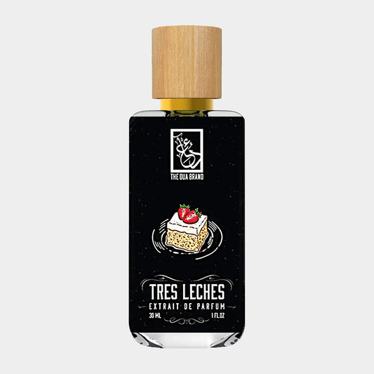 Dua Tres Leches Sample, a 30 ml perfume featuring a sleek black bottle with a wooden cap, inspired by the traditional dessert tres leches, adorned with a slice of cake and strawberry design.