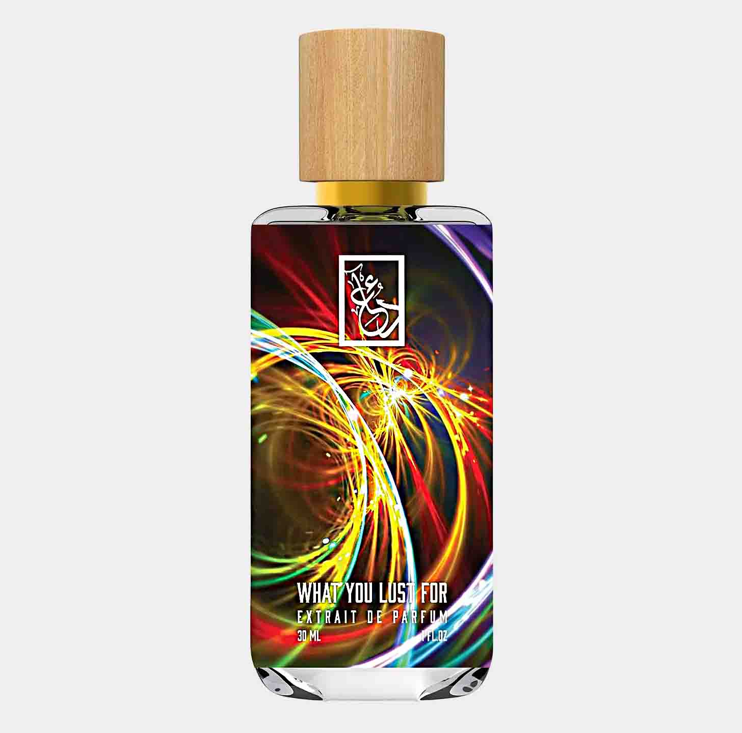 Dua What You Lust For Sample is a stylish 30ml bottle of extrait de parfum, featuring a vibrant, colorful design and a wooden cap.