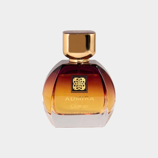 Admira Glamour full bottle, featuring an elegant round design with a gradient amber color and a gold cap, showcasing the brand's logo on the front.