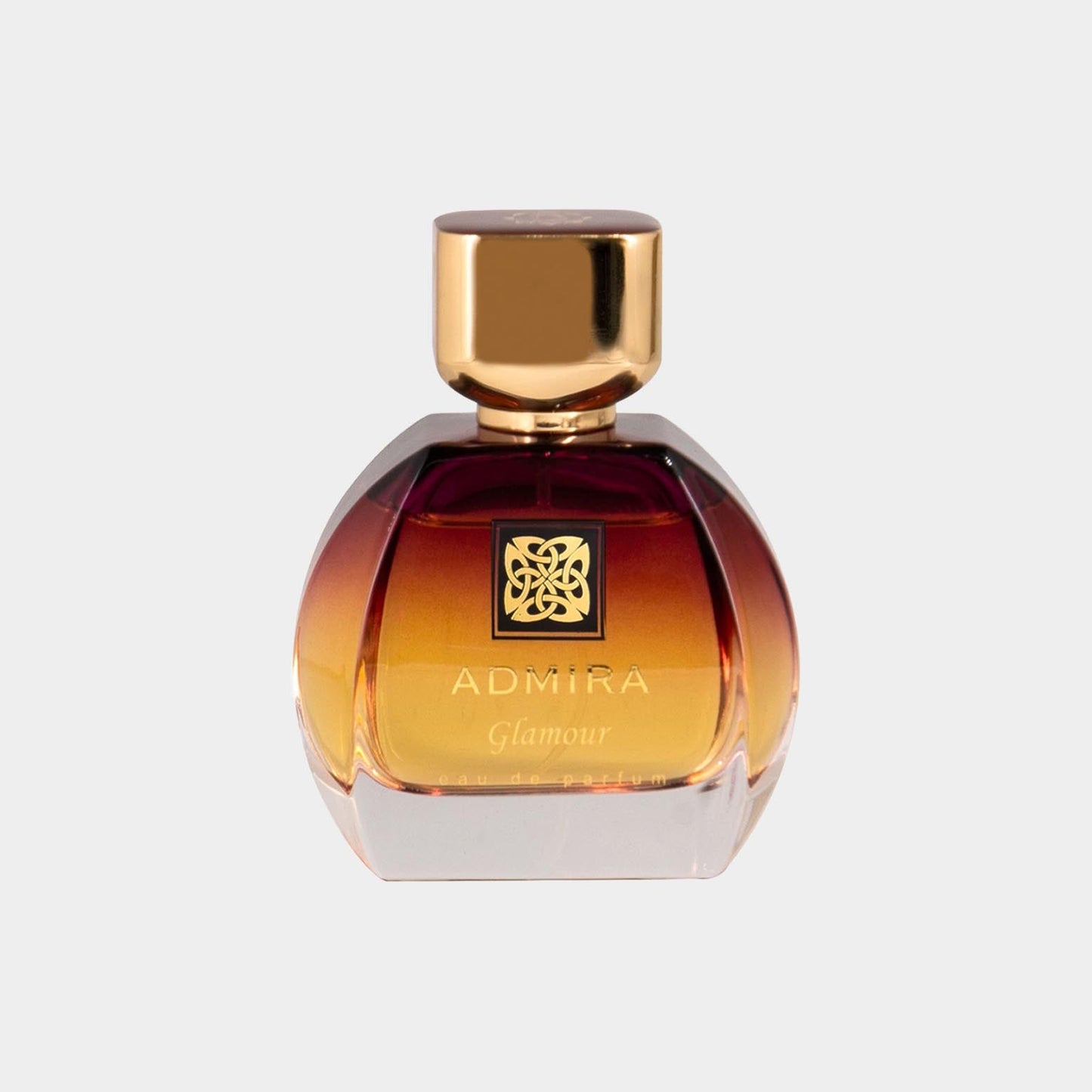 Admira Glamour Sample is an elegant perfume bottle featuring a rounded design with a smooth gradient from amber to clear glass, topped with a gold-colored cap.
