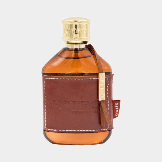 A sample bottle of Dumont Nitro Pour Homme, featuring a sleek design with a brown leather wrap and a gold cap, showcasing the warm amber liquid inside.