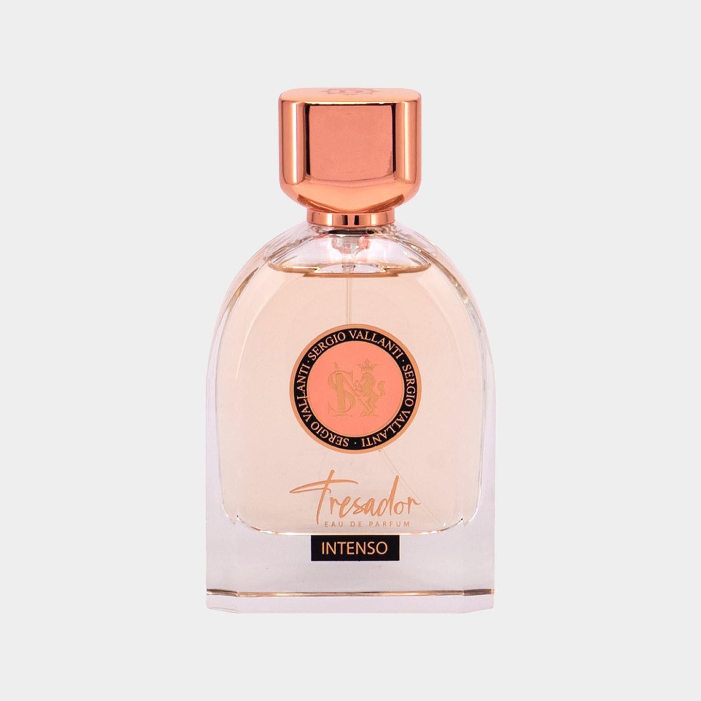 A clear glass bottle of Tresador Intenso perfume, featuring a rose gold cap and a prominent logo on the front, showcasing an elegant and sophisticated design.