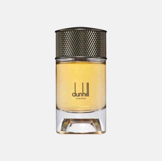 A small glass bottle of Dunhill Signature Indian Sandalwood Sample, featuring a textured silver cap and a clear liquid inside. The elegant design highlights the brand name Dunhill London on the front.